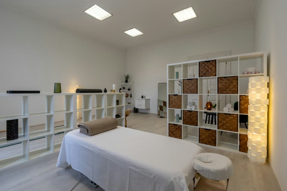 Prepared massage table in a bright treatment room